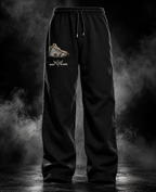 DUSTOFGODS black sweatpants front view with printed money pocket graphic