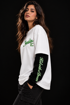 Kid with a Dream Oversized Doctor Sleeve Unisex T-Shirt by DUSTOFGODS, side view showing the white tee, black sleeves and neon green sleeve lettering.