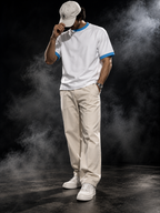 The Originals contrast-rib unisex T-shirt styled on a model, white with sky blue rib trim