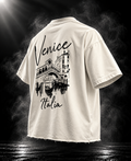 Venice Italia off white boxy fit unisex T-shirt angled back view with Rialto Bridge artwork